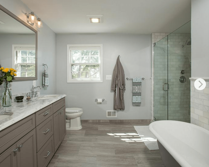 bathroom with glass shower and tub