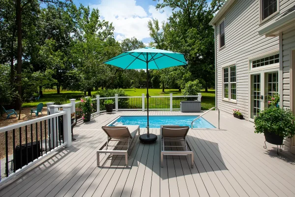 pool deck with seats and umbrellas