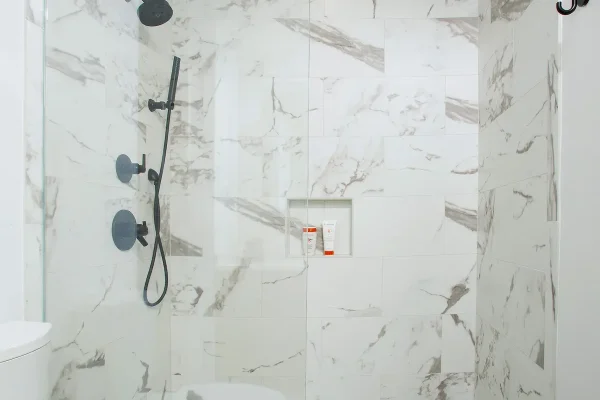 shower with marble tile