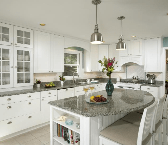 white kitchen with rounded kitchen island
