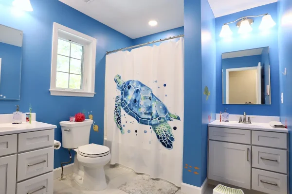 blue bathroom with turtle shower curtain