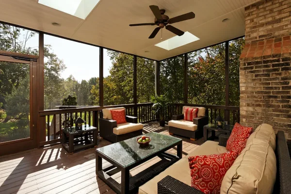 screened porch with brick wall